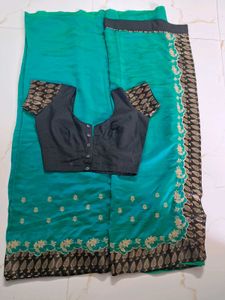 Beautiful Teal Saree with Embroidered Border