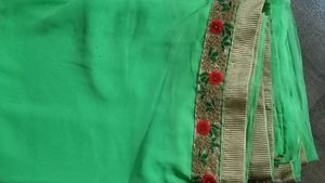 green colour saree with heavy cutwork border in pallu and golden work border all ever with stitched blouse