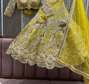 Stunning Yellow Peacock Embroidered Lehenga Choli