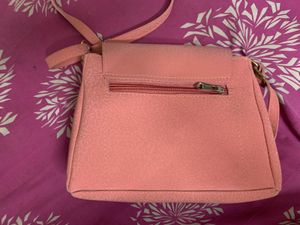 Chic Coral Crossbody Bag with Gold Chain Detail