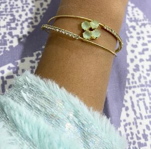 Elegant Gold-Tone Bangle with Gemstones