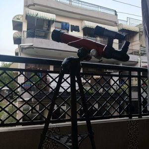 Red Telescope with Tripod