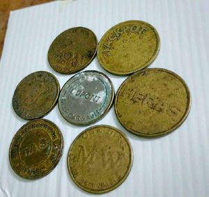 set of 7 used vintage Collectible tokens