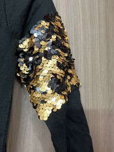 Black sequin sleeve top
