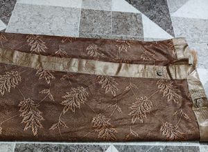 Elegant Brown Saree with Leaf Motif