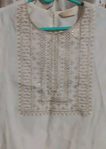 Elegant White Kurta with Embellished Neckline