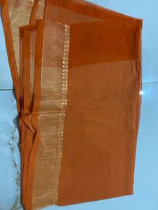 Elegant Orange Saree with Golden Border and  uns