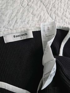 Stylish Black Ribbed Top with White Trim