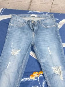 Distressed Light Wash Denim Jeans