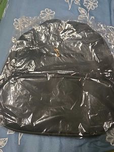 Stylish Black Backpack with Gold Zippers