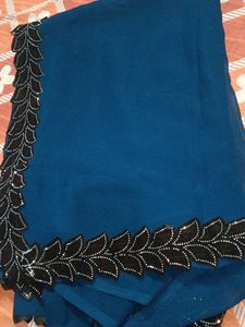 Elegant Teal Saree with Black Embellishments
