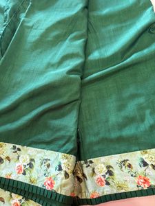 Elegant Green Saree with Floral Border