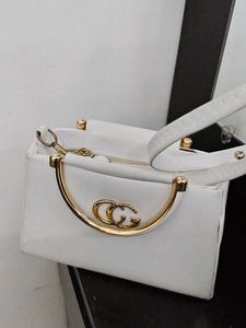 Chic White Handbag with Gold Accent