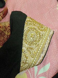 Elegant Black Blouse with Embellished Neckline
