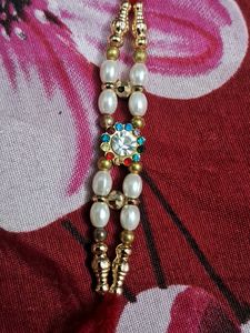 Elegant Rakhi with Pearls and Crystals set of 6 pc