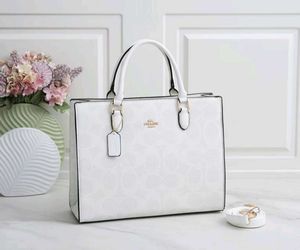 COACH**12A QUALITY HANDBAG* AT OFFER PRICE