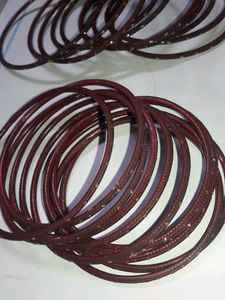 Set of Maroon Bangles with Gold Embellishments