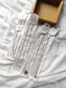 Set of 4 Gold Tone Necklaces