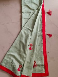 Elegant Light Green Saree with Red Border