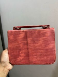 Stylish Red Crossbody Bag with Gold Embellishments