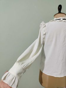 Ruffled White Blouse with Black Bow