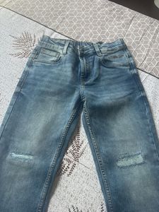 Distressed Blue Denim Jeans