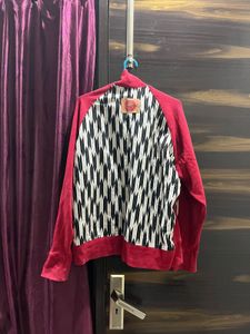 Red Zip-Up Jacket with Graphic Accents