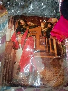 Vibrant Orange Saree with Intricate Embroidery