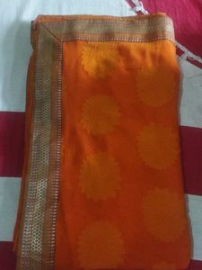 Orange Saree with Floral Motifs