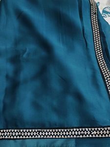 Elegant Teal Saree with Embellished Border