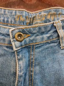 Distressed Blue Denim Jeans