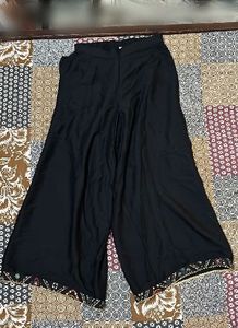 Elegant Black Palazzos with Embroidered Hem