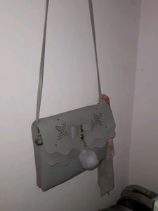 Grey Bow Detail Crossbody Bag with Pom Po