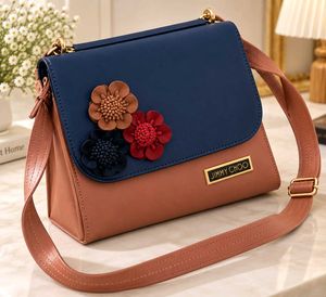 Chic Two-Tone Handbag with Floral Embellishments