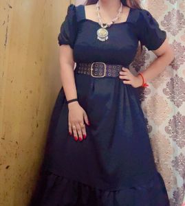 Elegant Black Dress with Statement Necklace