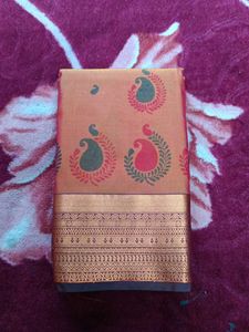 Elegant Peach Saree with Peacock Motif