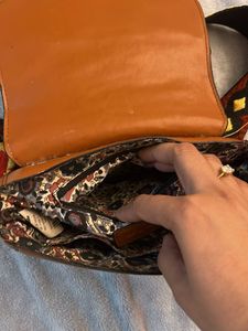 Stylish Brown Crossbody Bag with Embellished Strap