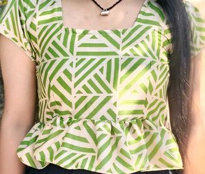 This is a light green crop top.
