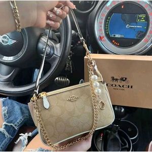 COACH NOLITA DAISY APPLIQUE BAG, FEATURE WITH A PE