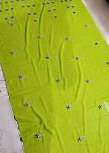 It's a Green coloured saree with blouse