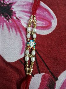 Elegant Rakhi with Pearls and Crystals set of 6 pc