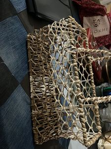 Woven basket on a metal frame