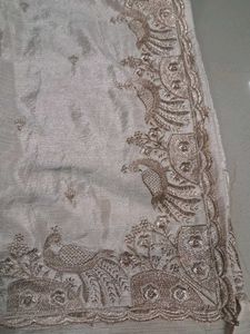 Elegant Cream Saree with Peacock Embroidery