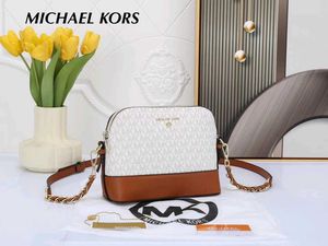 MICHAEL KORS* *MEDIUM LOGO DOME CROSSBODY SLING BA