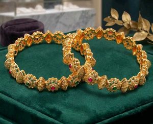Elegant Gold Bangle with Stone Embellishments