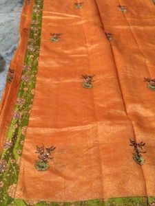 Elegant Orange Saree with Floral Print