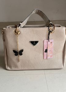 Stylish Beige Textured Handbag with Butterfly Char