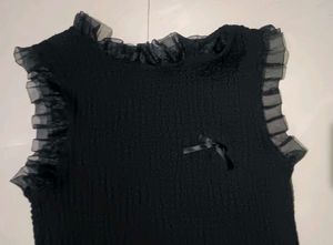 Chic Black Smocked Top with Bow Accent