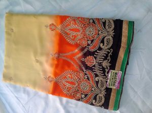 Elegant Cream &amp; Orange Embroidered Saree