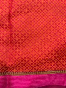 Vibrant Red Saree with Intricate Pattern